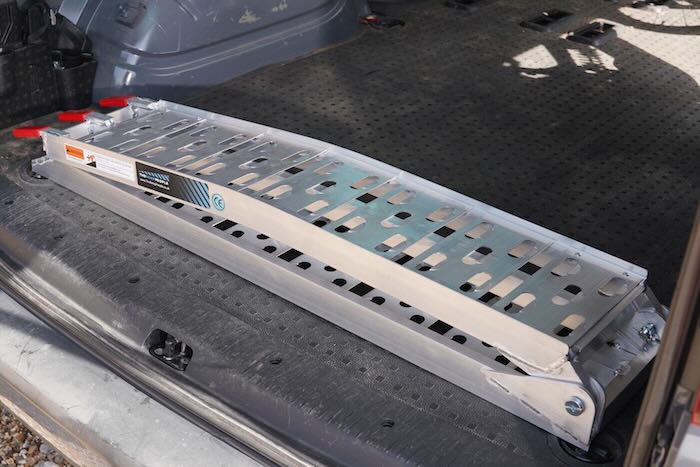 Folded motorbike ramp in van 