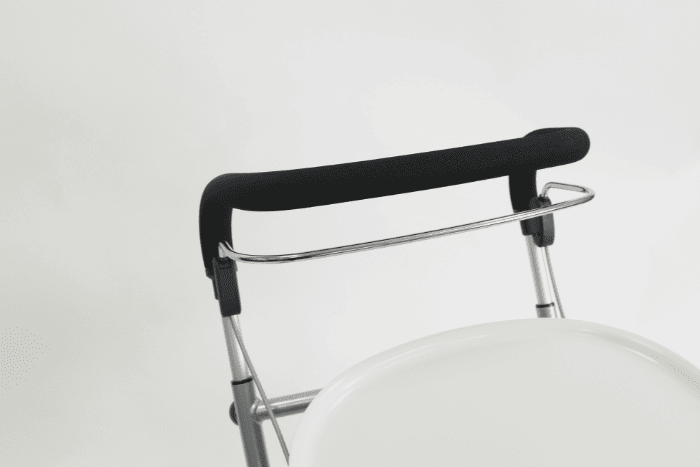 Full width brake handle on indoor rollator