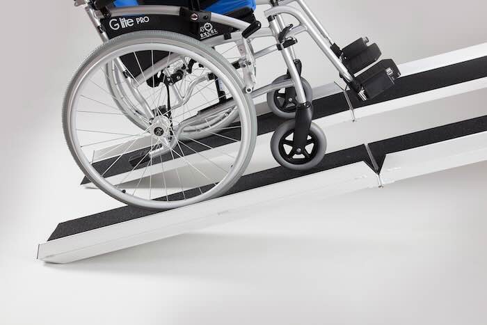 Pair of mobility scooter loading ramps in use 