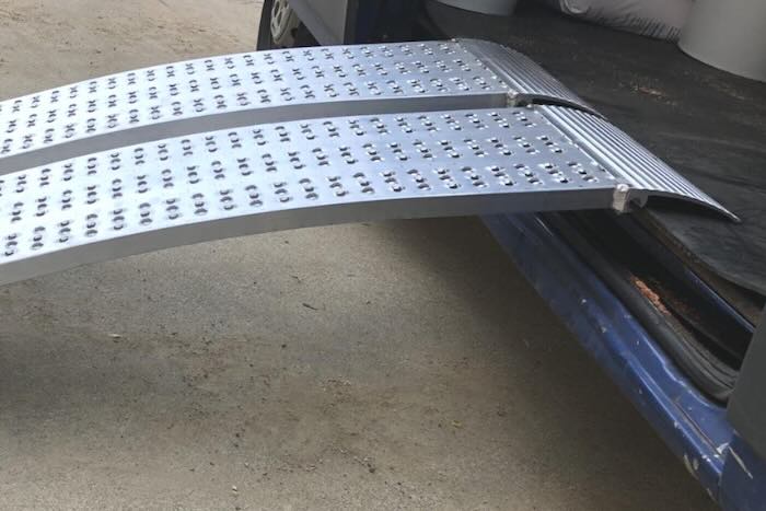 Loading ramps resting on van Loading ramps resting on van
