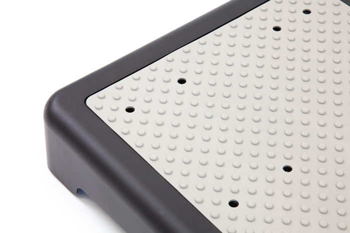 Half step with self-draining surface