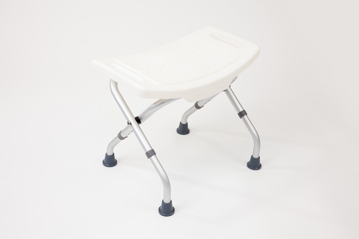 White folding shower stool with curved feet 