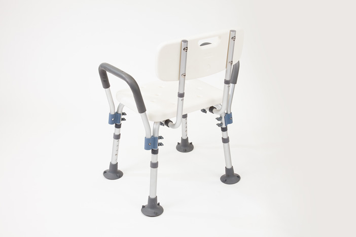Rear view of the plastic shower chair with armrests and backrest