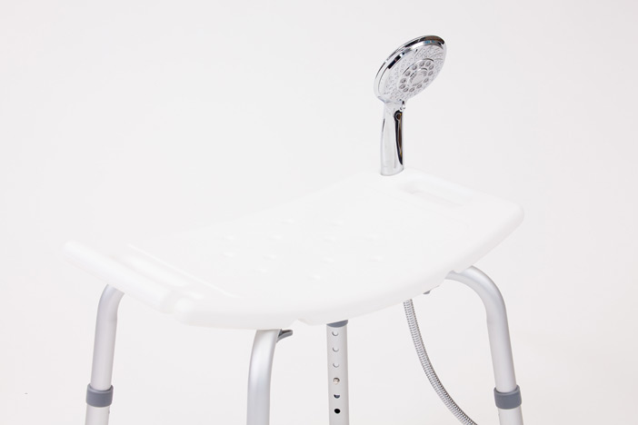 White plastic shower stool with shower head holder