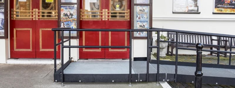 Modular wheelchair ramp with handrails outside a theatre 