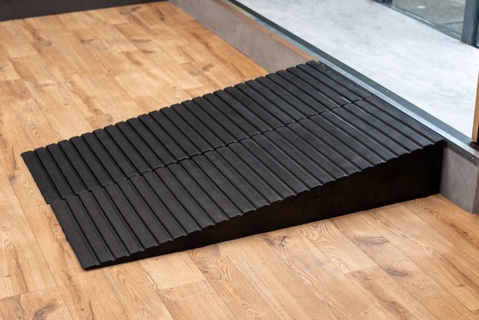 Pair of rubber ramps infront of step