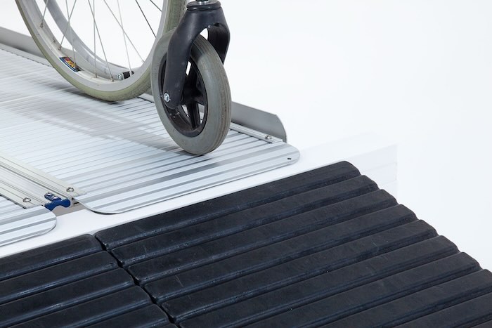 Wheelchair going up aluminium foldable wheelchair ramp Wheelchair going up aluminium foldable wheelchair ramp