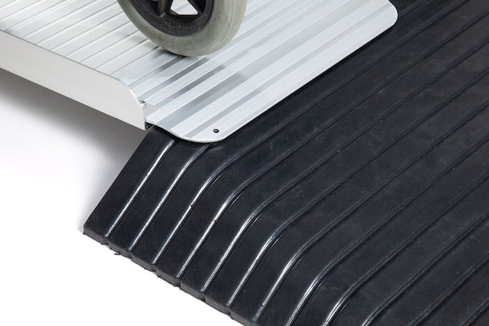 Wheelchair going up aluminium foldable wheelchair ramp Wheelchair going up aluminium foldable wheelchair ramp