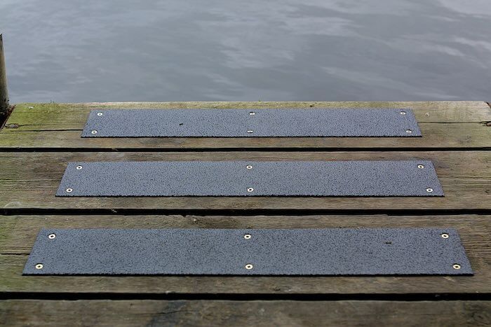 Anti-slip strips installed on decking by the water 