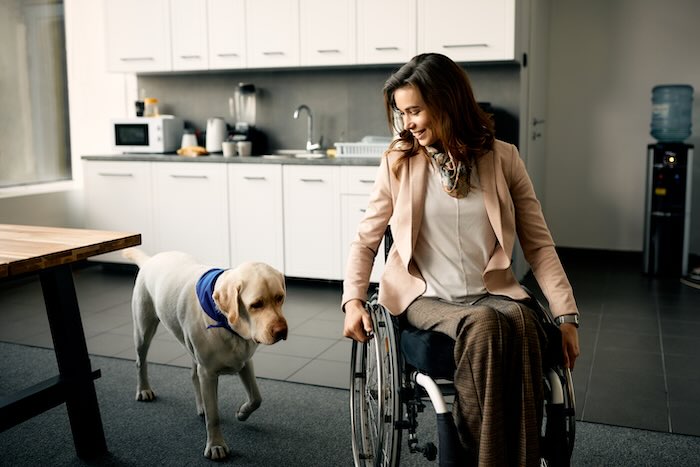 Lady in wheelchair with a dog 