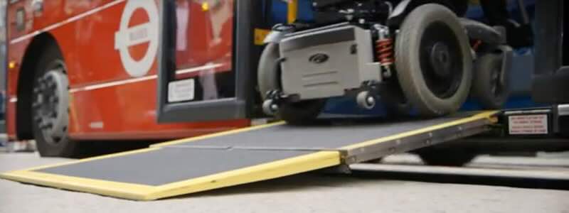 Mobility scooter going up ramp into bus