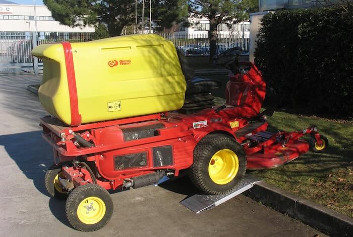 Forklift driving up container ramps 