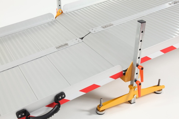 Folding wheelchair ramps connected on joining support