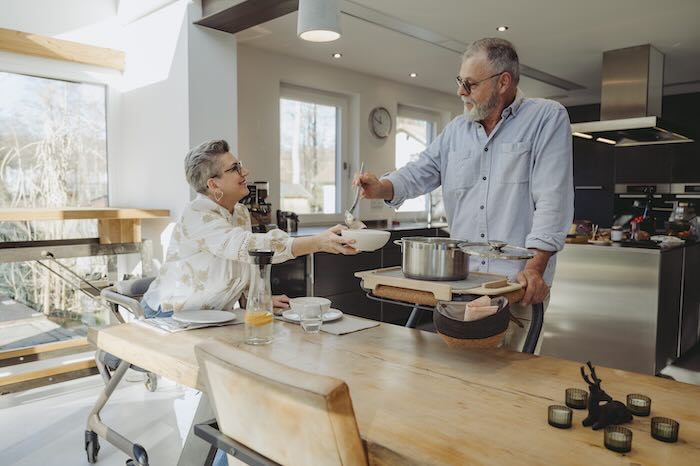 Indoor rollator with tray in use in kitchen 