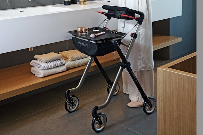 Space Pixel indoor rollator with makeup on the tray 