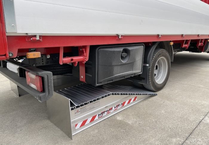 Pair of aluminium wheel risers in loading bay 