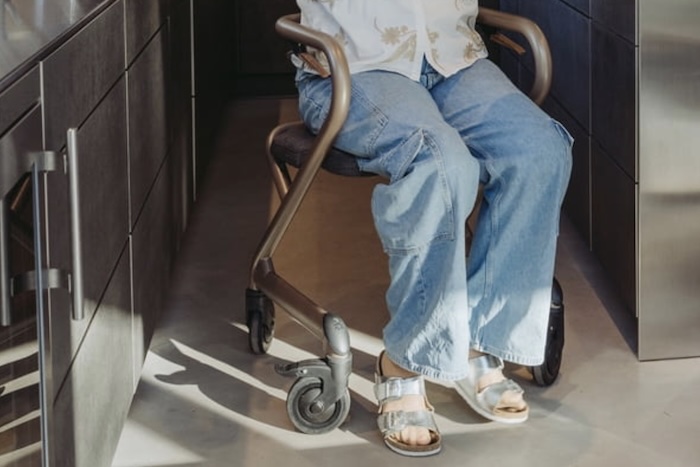 Lady sat on Rollator with seat Lady sat on Rollator with seat