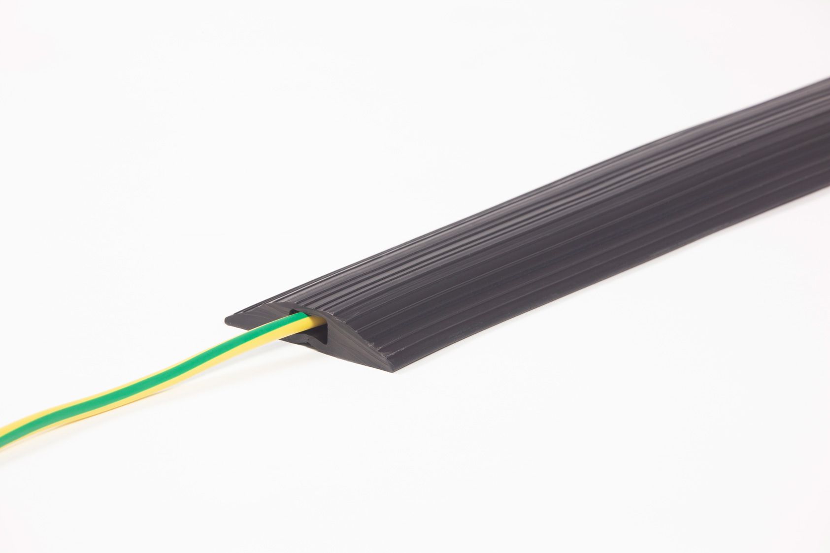 Floor cable protector with cable passing through 