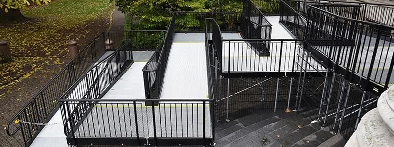 Modular wheelchair ramp with multiple platforms and handrails 