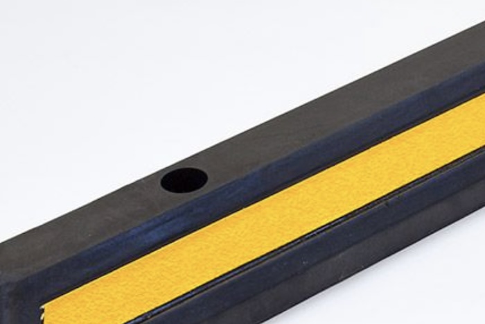 Wheel stop with pre-drilled fixing points 