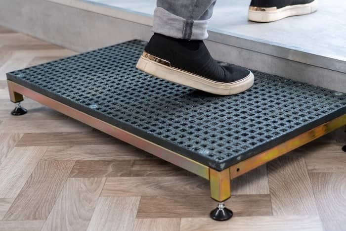 Person walking up half step Person walking up half step