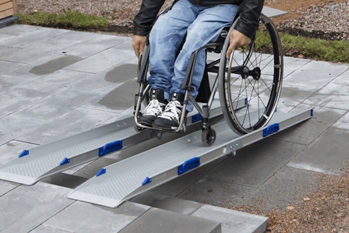 Man going up a pair of channel ramps 