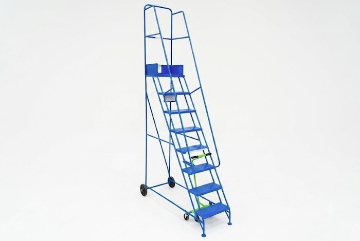 Tall steel mobile ladder with dual handrails, a work platform and toe plate. Blue ladder provided on wheels with a central brake. 