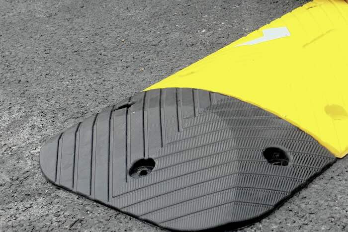 speed bump kit installed on tarmac road
