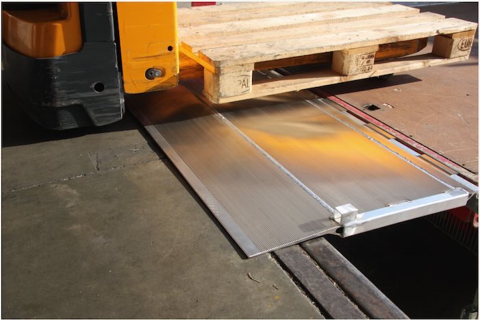 Pallet truck on hinged tailboard