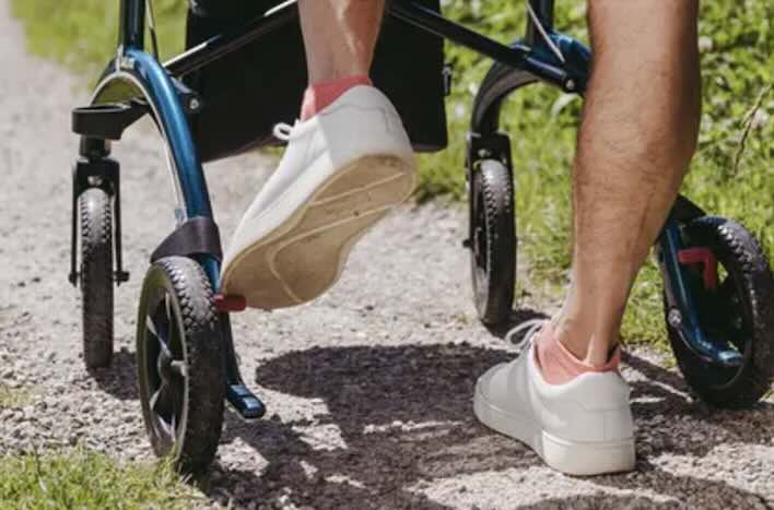 Saljol Carbon Rollator being used outdoors 