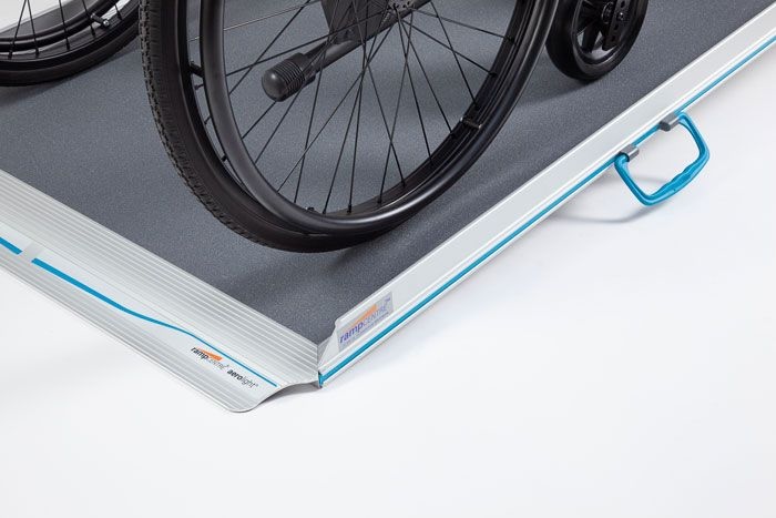 Wheelchair going up wheelchair ramp