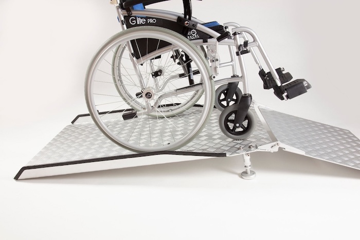 Wheelchair ramp going up and over bridge threshold ramp