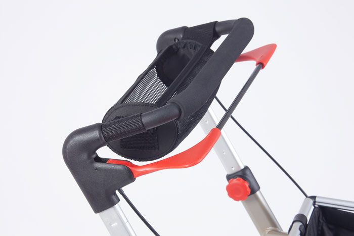 Rollator with full width brake handle