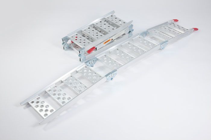 Tri-fold motorbike ramp showing one ramp folded, the other ramp at full length