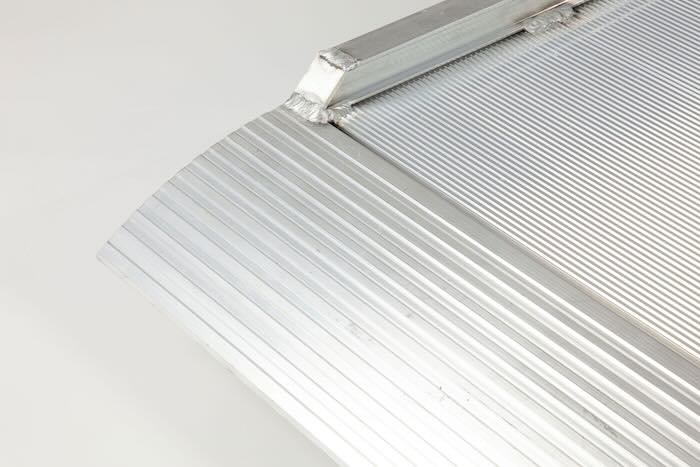 Van ramp with raised edges